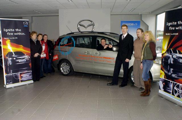 John O’Shaughnessy (Mayo Co-Ordinator Special Olympics), receiving the keys of a Mazda 5 courtesy car, from David Monaghan (Monaghan & Sons Breaffy Rd Castlebar), L-R: Pauline Flynn (Special Olympics), Jackie Murphy (Special Olympics), Ann Cattigan (Special Olympics), John O’Shaughnessy, David Monaghan, Ryan Ring (Graphics Manager Connacht Signs) who designed the sign writing on the car for the Special Olympics, Maggie Ahern (Special Olympics) . Photo Ken Wright Photography 2007