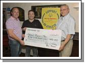 John Conroy (left) from the "Rendezous" bar, Balla, whom helped organise the Balla Inter-pub Quiz, pictured with John Shaughnessy (centre), county co-ordinator and Pat O'Malley (right) main sponsor (Blue Thunder). The quiz was held to help raise funds for the Special Olympics Mayo. Photo: Studio 094