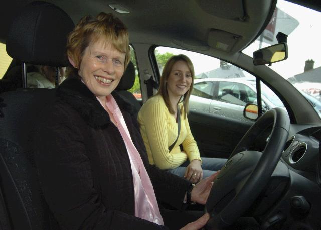 Pictured in Edward Conways Garage Newport Rd. Castlebar the Duffy family from Parke receiving the keys of a Citroen C3, they were the winners of the Castlebar Credit Union May Members Draw which took place in Bosh  Michelle and  Mary Duffy,in their new car. Photo  KWP Studio 094. 


