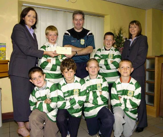 Pictured in Castlebar Credit Union at a presentation of a sponsorship cheque to Gerry Conway Team manager Castlebar Under 12s Community Games Team 
Majella Mulchrone (CU) and Gerry Conway, Anne King (CU), Photo  Ken Wright Photography 2007  
