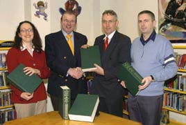 Eamonn Bourke publisher of the Great Irish Book of Genealogies presents a copy to Austin Vaughan. Click photo for more details from Ken Wright.