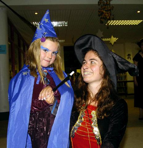 Pictured at Castlebar Library, at the launch of J K Rowlings Harry Potter and the Deathly Hallows. Uisce De Burca casting a spell on Oriel Burke. Photo  Ken Wright Photography 2007.  