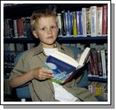 Pictured at Castlebar Library, at the launch of J K Rowlings Harry Potter and the Deathly Hallows. Vlav Khokhe enjoying the hair-raising story .  Photo  Ken Wright Photography 2007. 