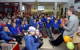 Author Malachy Doyle reading to a crowded library at the recent children's book festival. Click photo for more from Ken Wright.