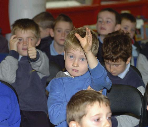 Mayo Libraries Childrens Book Festival author Malachy Doyle reading from some of his books to children from St. Anthonys, Scoil Raifteri and St. Angelas National Schools in Castlebar Library. Hands Up!. Photo  studio 094. 