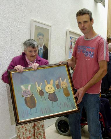 Pictured in the Linenhall Arts Centre Castlebar the Autumn into Summer Art Exhibition by a group of artists from the Sacred Heart Home Castlebar which was opened by Deirdre Walsh (Arts Programme Co-ordinator HSE West). Myrna Hayden with one of her paintings which was on display and Mark Walsh artist in residence. Photo  Ken Wright Photography 2007 

