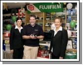 RTEs Podge Kelly pictured in Stauntons Digital One Hour Photo for the Fuji Digital Care promotion held on Saturday 8th December L-R: Teresa Forry, Podge Kelly and Mary Moran (Manageress). Photo Ken Wright Photography 2007. 