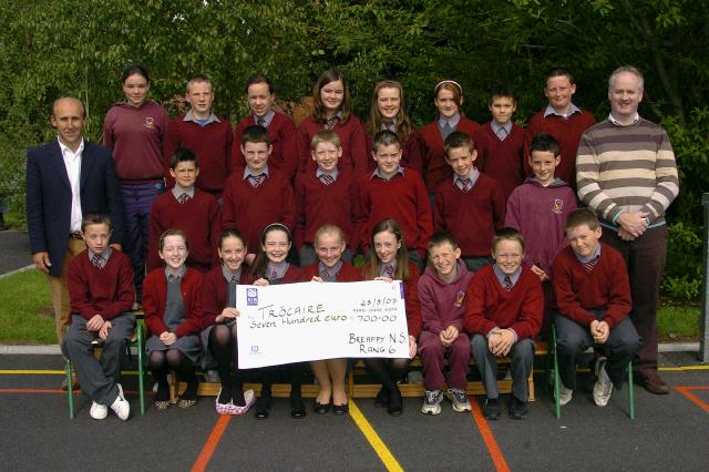The children of sixth class in Breaffy N.S. recently held a jumble sale, cake sale, and fun day in their school to raise funds for three chariries Trocaire, Special Olympics and the Chernobyl Childrens Fund. The children participated in many fun filled activities (basketball shots, video games, go-cart rides etc,) and at the end of the day an incredible sum of 2,100 euro had been raised which was divided among the three charities. Well done to all involved. The children with Sean Grealis (teacher) and George Moran (Principal) are pictured with a cheque for 700 Euro to Trocaire. Photo  Ken Wright Photography 2007 