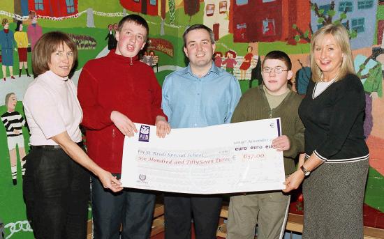 Pictured in St. Brids, James Kilbane, who raised 657.00 by running the Dublin Marathon The will be used for the St. Brids Playground Fund,
L-R:  Catherine Craughwell (principal), Niall Egan, James Kilbane, James Mulvaney, Majella Murray Teacher: Photo  Ken Wright Photography 2004.
