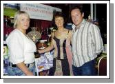Castlebar Golf Club Winner of the Lady Captains Prize Deidre Moylett being presented with her prize by Lady Captain Teresa Reddington also in the picture Tom Moylett. Photo  Ken Wright Photography 2007. 