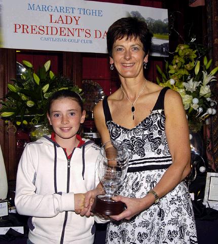 Castlebar Golf Club Lady Presidents Night Presentations Margaret Tighe Lady President presenting the Lady President Perpetual Trophy to the best junior girl Sarah Prendergast.  Photo  Ken Wright Photography 2007. 

