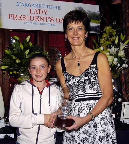 Castlebar Golf Club Lady Presidents Night Presentations Margaret Tighe Lady President presenting the Lady President Perpetual Trophy to the best junior girl Sarah Prendergast.  Photo � Ken Wright Photography 2007. 

