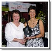 Castlebar Golf Club Lady Presidents Night Presentations Margaret Tighe Lady President presenting Sheila Baines with the Lady Presidents Prize.  Photo  Ken Wright Photography 2007. 