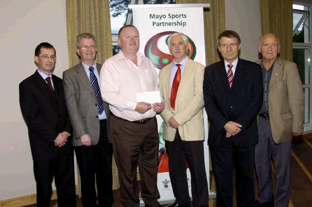 Mayo Sports Partnership 2007 Special Participation Grant Scheme recipients
Pictured in Breaffy International Sports Hotel, John Gallagher representing Grove Tug of War Club receiving his cheque from the members of the Mayo Sports Partnership Board L-R: Gerry McGuinness,  Tony Cawley, John Gallagher, Bernard Comiskey, Pat Stanton (Chairman Mayo Sports Partnership Board), Mick Loftus .Photo  Ken Wright Photography 2007 
