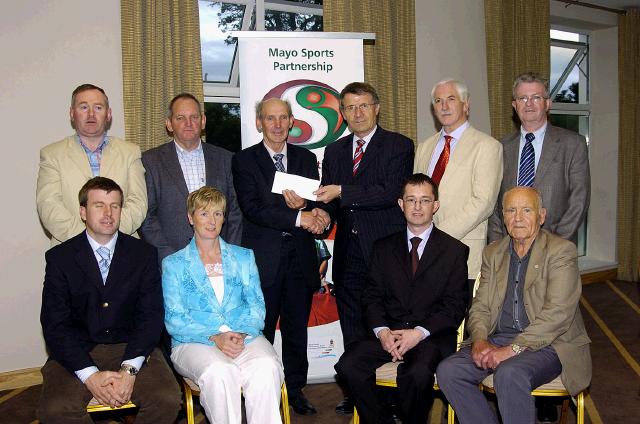 Mayo Sports Partnership 2007 Special Participation Grant Scheme recipients
Pictured in Breaffy International Sports Hotel, Michael McGinty representing Achill GAA Club receiving his cheque from the members of the Mayo Sports Partnership Board Front L-R: Niall Sheridan (Mayo County Council), Teresa Ward, Gerry McGuinness , Mick Loftus. Back L-R: Micheal McNamara (Mayo County Council), Hughie McGinty, Michael McGinty (Achill GAA Club), Pat Stanton (Chairman Mayo Sports Partnership Board), Bernard Comiskey, Tony Cawley,  .Photo  Ken Wright Photography 2007 
