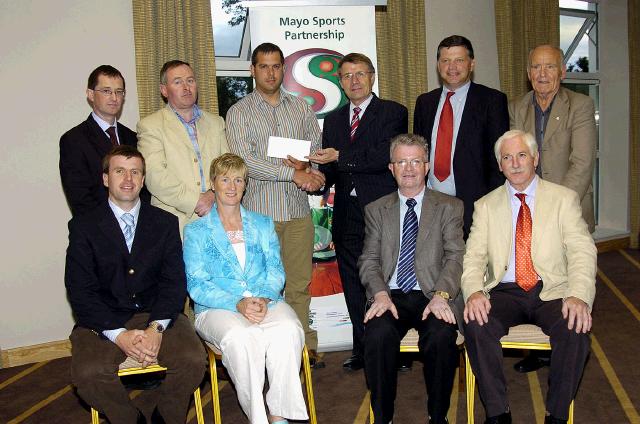 Mayo Sports Partnership 2007 Special Participation Grant Scheme recipients
Pictured in Breaffy International Sports Hotel, Karan Martinez representing Castlebar Athletic Club receiving his cheque from the members of the Mayo Sports Partnership Board Front L-R: Niall Sheridan (Mayo County Council), Teresa Ward, Tony Cawley,  Bernard Comiskey. Back L-R: Gerry McGuinness, Micheal McNamara (Mayo County Council), Karan Martinez, Pat Stanton (Chairman Mayo Sports Partnership Board), John OMahony (Mayo GAA Team Manager), Mick Loftus. .Photo  Ken Wright Photography 2007 

