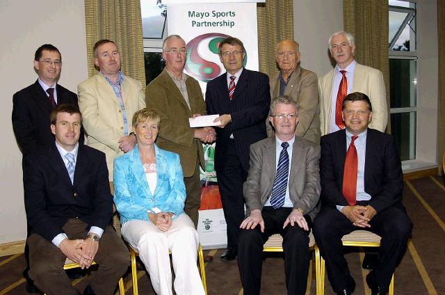 Mayo Sports Partnership 2007 Special Participation Grant Scheme recipients
Pictured in Breaffy International Sports Hotel, Michael Carney representing Ballina Junior Badminton Club receiving his cheque from the members of the Mayo Sports Partnership Board Front L-R: Niall Sheridan (Mayo County Council), Teresa Ward, Tony Cawley, John OMahony (Mayo GAA Team Manager), Back L-R: Gerry McGuinness, Micheal McNamara (Mayo County Council), Michael Carney, Pat Stanton (Chairman Mayo Sports Partnership Board), Mick Loftus, Bernard Comiskey. .Photo  Ken Wright Photography 2007 
