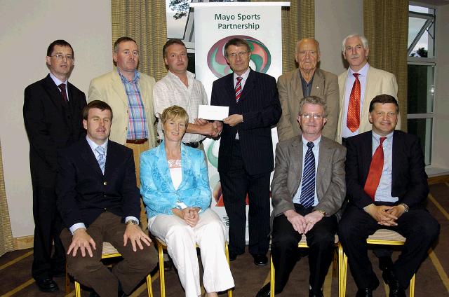 Mayo Sports Partnership 2007 Special Participation Grant Scheme recipients
Pictured in Breaffy International Sports Hotel, Michael John Mason representing Ogras Saoirse Dooniver Achill receiving his cheque from the members of the Mayo Sports Partnership Board Front L-R: Niall Sheridan (Mayo County Council), Teresa Ward, Tony Cawley, John OMahony (Mayo GAA Team Manager), Back L-R: Gerry McGuinness, Micheal McNamara (Mayo County Council), Michael John Mason, Pat Stanton (Chairman Mayo Sports Partnership Board), Mick Loftus, Bernard Comiskey. .Photo  Ken Wright Photography 2007

