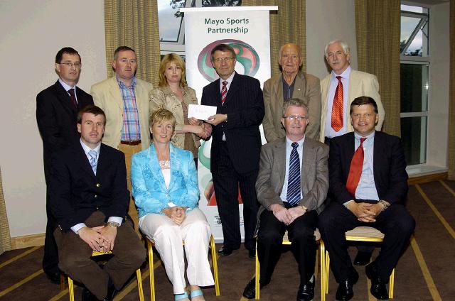 Mayo Sports Partnership 2007 Special Participation Grant Scheme recipients
Pictured in Breaffy International Sports Hotel, Kate Boyle (Treasurer) representing Parke Community Centre receiving her cheque from the members of the Mayo Sports Partnership Board Front L-R: Niall Sheridan (Mayo County Council), Teresa Ward, Tony Cawley, John OMahony (Mayo GAA Team Manager), Back L-R: Gerry McGuinness, Micheal McNamara (Mayo County Council), Kate Boyle, Pat Stanton (Chairman Mayo Sports Partnership Board), Mick Loftus, Bernard Comiskey. .Photo  Ken Wright Photography 2007 
