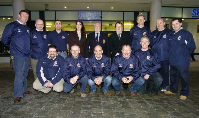 Pictured outside Shaws Department Store Castlebar at a presentation of shirts for the Under age team Castlebar Rugby Club Carmel McTigue (General Manager Shaws Department Store) and Nigel Bradley (Retail Manager Shaws Department Store),  . pictured with members of the coaching team Front L-R:  John Mulligan (Mid West radio Sports Commentator), Paul OReilly, Mark Gaffney, Michael Tobin, John Hannigan. Back L-R: Steve Allen, Keith Finan, Michael Hastings, Carmel McTigue, 
Trevor Ardle (President Castlebar Rugby Club), Nigel Bradley, Paul Gannon, 
Liam Whyte, Shane McElwee. Photo  Ken Wright Photography 2007. 

