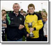 Ballina V Swinford  Kenneth Gannon fixtures secretary Mayo Schoolboys and Girls Youths presenting the under 14 league cup to Ballina team captain Brendan Murray. Photo Ken Wright 