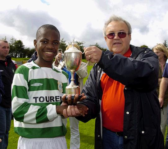 Castlebar Celtic v Westport.  Celtic team captain Noe Baba Receivind the under 12 league cup from Brian Jonston. Photo Ken Wright. 