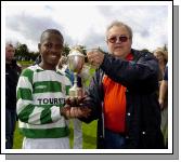 Castlebar Celtic v Westport.  Celtic team captain Noe Baba Receivind the under 12 league cup from Brian Jonston. Photo Ken Wright. 