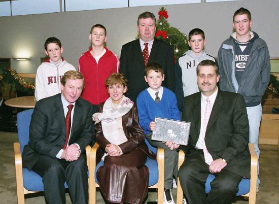 Enda Kenny TD & Leader of Fine Gael, presents Art  Silleabhin (ICT Advisor with Mayo Education Centre) with the Hibernia College Person of the Year 2004 Award, at a ceremony in Mayo Education Centre with the  Silleabhin family.
(Front L-R) Enda Kenny TD & Leader of Fine Gael, Mire U Shilleabhin, Leas Promh Oide Scoil Raifteir, Art g  Silleabhin.
(Back L-R) Fiachra  Silleabhin, Cian  Silleabhin, Dr. Sen Rowland (Chairman of Hibernia College), Darach  Silleabhin, Eoin  Silleabhin. (Photography by Ken Wright)
