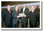 Enda Kenny TD & Leader of Fine Gael, presents Art  Silleabhin (ICT Advisor with Mayo Education Centre) with the Hibernia College Person of the Year 2004 Award, at a ceremony in Mayo Education Centre.
(L-R) Dr. Sen Rowland (Chairman of Hibernia College), Enda Kenny TD & Leader of Fine Gael, Art  Silleabhin (ICT Advisor with Mayo Education Centre) & Denis OBoyle (Director Mayo Education Centre). (Photography by Ken Wright)
