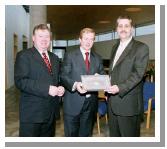 Enda Kenny TD & Leader of Fine Gael, presents Art  Silleabhin (ICT Advisor with Mayo Education Centre) with the Hibernia College Person of the Year 2004 Award, at a ceremony in Mayo Education Centre.
(L-R)  Dr. Sen Rowland (Chairman of Hibernia College), Enda Kenny TD & Leader of Fine Gael & Art  Silleabhin, Hibernia College Person of the Year 2004. (Photography by Ken Wright)
