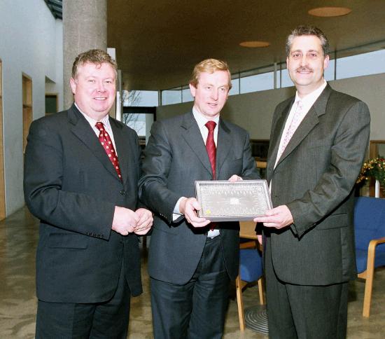Enda Kenny TD & Leader of Fine Gael, presents Art  Silleabhin (ICT Advisor with Mayo Education Centre) with the Hibernia College Person of the Year 2004 Award, at a ceremony in Mayo Education Centre.
(L-R)  Dr. Sen Rowland (Chairman of Hibernia College), Enda Kenny TD & Leader of Fine Gael & Art  Silleabhin, Hibernia College Person of the Year 2004. (Photography by Ken Wright)
