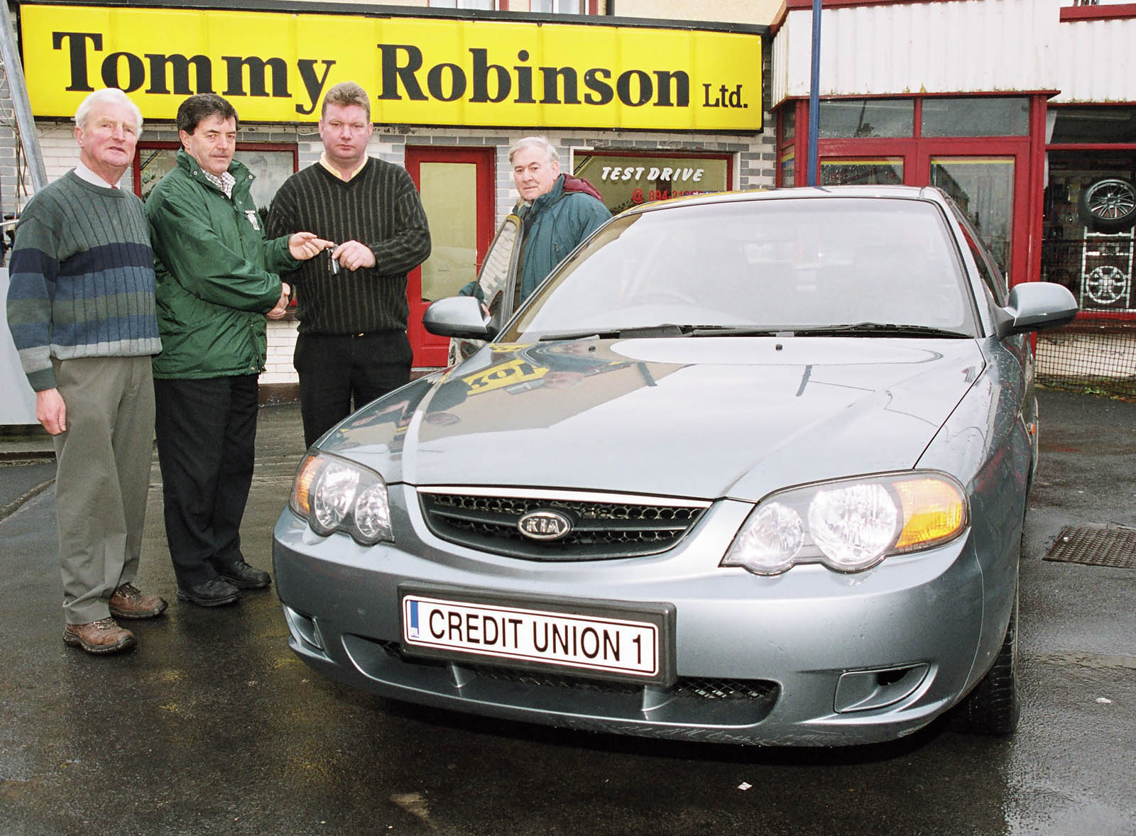 Castlebar Credit Union Decembers Members draw winner of the first prize Michael McHale from Parke being presented with the keys of a Kia Rio car supplied from Tommy Robinsons Garage Spencer St Castlebar by John Burke. L-R: Tommy Robinson (proprietor), John Burke (CU), Michael McHale (Winner), Jack Loftus (CU). Photo  Ken Wright Photography 2005. 