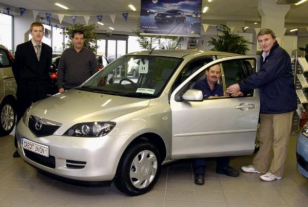 Pictured in Monaghans Garage Castlebar John Walsh representing Castlebar Credit Union presenting the keys of a Mazda 2 to Matty Togher from Castlebar Winner of the Winter Members Draw L-R: David Monaghan, John Burke, Matty Togher, John Walsh. Photo  KWP Studio 094. 

