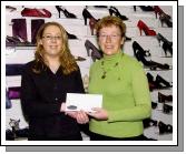 Pictured in Paul Byron Shoe Shop Market Square Castlebar, Breda OConnell from Tourmakeady winner of the Eco shoe promotion 500 euro holiday voucher L-R: Finnoula ODonnell (Sales Assistant), Breda OConnell. Photo  Ken Wright Photography 2007.