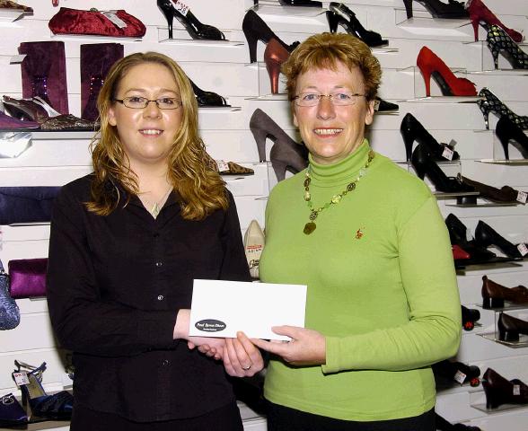 Pictured in Paul Byron Shoe Shop Market Square Castlebar, Breda OConnell from Tourmakeady winner of the Eco shoe promotion 500 euro holiday voucher L-R: Finnoula ODonnell (Sales Assistant), Breda OConnell. Photo  Ken Wright Photography 2007.