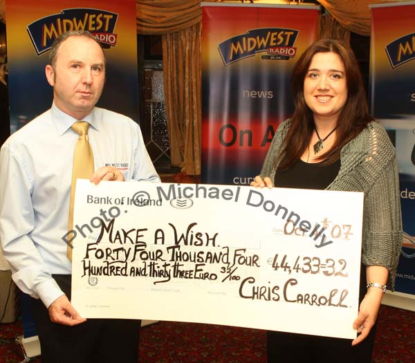 Mid West Radio presenter Chris Carroll  presents a cheque from the Magnificent 7 Fundraising Challenge to Noreen McKenzie of Make a Wish Foundation for 44,433 Euros and 32 cent. Photo:  Michael Donnelly
