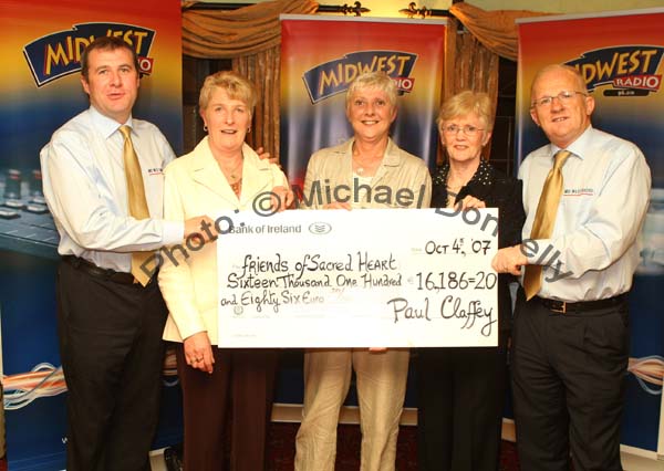 Gerry Glennon and Paul Claffey of Mid West Radio present a cheque for16,186 Euros and 20 cent from the Magnificent 7 Fundraising Challenge to Friends of the Sacred Heart Hospital, Castlebar from left: Gerry Glennon, Teresa O'Haire, Regina Mulroooney, Teresa Quigley and Paul Claffey. Photo:  Michael Donnelly 