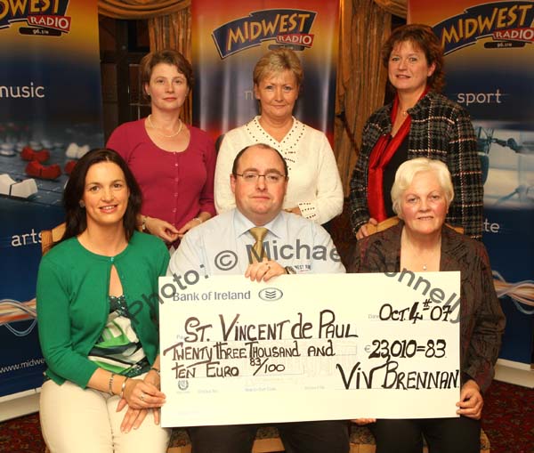 Viv Brennan of Mid West Radio presents a cheque fo 23,010 Euros and 83 cent from the Magnificent 7 Fundraising Challenge to St Vincent de Paul, front from left: Carmel Bolster, Viv Brennan and Kay Veale; at back: Una Jordan, Joan Redmond, and Anne Leonard. Photo:  Michael Donnelly