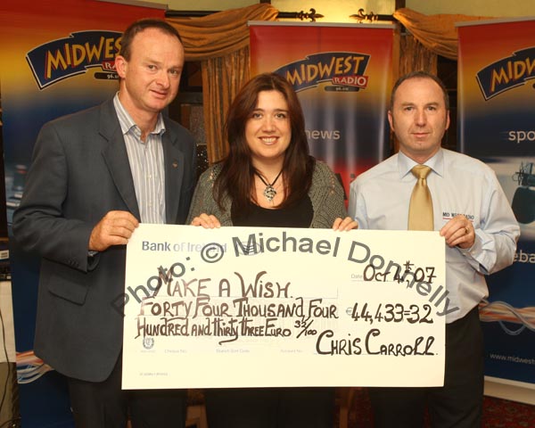 John Flannelly (Ballinrobe Race Course) and Chris Carroll Mid West Radio rpresent a cheque from the Magnificent 7 Fundraising Challenge to Noreen McKenzie of Make a Wish Foundation for 44,433 Euros and 32 cent. Photo:  Michael Donnelly