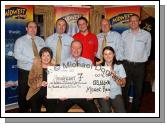The Magnificent 7 from Mid West Radio pictured with a cheque for 178,666 Euros and 94 cent, which they presented to various Mayo charities, front from left, Teresa O'Malley, Tommy Marren and Angelina Nugent; at back from left: Viv Brennan Chris Carroll,  David Cawley, Paul Claffey and Padraic Walsh. Photo:  Michael Donnelly