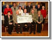 Tommy Marren of Mid West Radio present a cheque for 16,741 Euros and 15 cent from the Magnificent 7 Fundraising Challenge to Mayo Mental Health pictured front from left: Kathleen McHale, secretary, Mickey Berry; Tommy Marren Mid west Radio; PJ Murphy, Chairman Mayo Mental Health, and Dr Fidelma Creaven; At back from left: Kathleen Brawn, Michael Larkin, Mary Murphy, Maura Berry, Cllr Eugene McCormack, Mayor of Castlebar; Nellie Egan, Tony O'Boyle and Sr. Ita Hoban. Photo:  Michael Donnelly