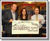 John Flannelly (Ballinrobe Race Course) and Chris Carroll Mid West Radio rpresent a cheque from the Magnificent 7 Fundraising Challenge to Noreen McKenzie of Make a Wish Foundation for 44,433 Euros and 32 cent. Photo:  Michael Donnelly