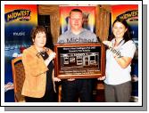 Teresa O'Malley, Mid West Radio (News) and Angelina Nugent, Mid West Radio (Sport) present an Inscribed Mirror to  Seamus Curley team member of Goonan's Pub Kilkelly, Overall winners of the Most Intelligent Pub in Mayo in the Magnificent 7 Charity Challenge. Photo:  Michael Donnelly