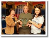 Michael Herr, of the Broken Jug Quiz team Ballina who were Regional Winners in the  Most Intelligent Pub in Mayo is presented with a Plaque by Teresa O'Malley, Mid West Radio (News) and Angelina Nugent Mid West Sport. Photo:  Michael Donnelly