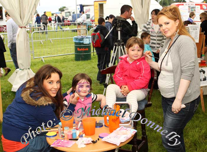 Elaine and Aisling Leydon from the Face Painting Company put the finishing touches on Caoimhe Doherty, Foxford and Aine McHale Ballina at Bonniconlon 61st Agricultural Show and Gymkhana. Photo: © Michael Donnelly
