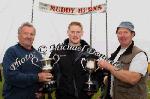 Ciaran Mullarkey, Bonniconlon  (centre) winner of the Senior Irish Championship Sheaf Tossing  is presented with the  Willie Fox Cup by Mick O'Malley and the Ballyman Cup for AllIreland U-21 Championship by John Greavy (on right) at Bonniconlon 61st Agricultural Show and Gymkhana . Photo: © Michael Donnelly