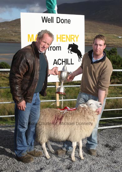 The Danny English Cup is presented by his nephew Pat Vesey to Liam Brennan  for best Crossbred Ewe Lamb (confined) at the Achill Sheep Show at Pattens Bar, Derreens Achill. Photo:  Michael Donnelly