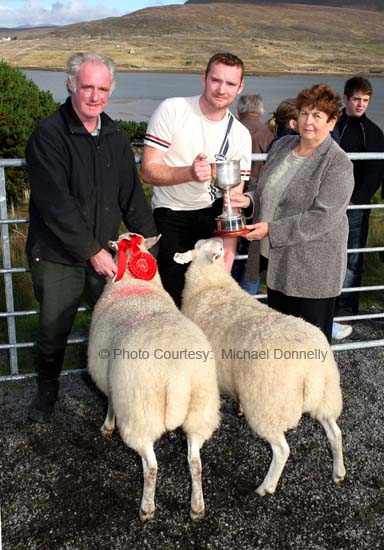 Maureen Johnston, Westport/Cloughmore presents the Thomas Johnston Cup to John and Edward Fadian, Dookinella  for best pen of 2 Crossbred Ewes (Open) at the 21st Achill Sheep Show (Taispentas Caorach Acla 2007) at Pattens Bar, Derreens Achill. Photo:  Michael Donnelly