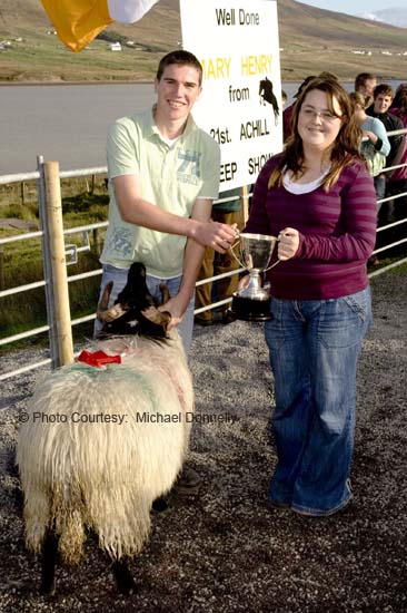 Gemma Patten presents the Patten's Bar Cup to Stephen Grealis, Currane for Best Ram Lamb (Confined) at the 21st Achill Sheep Show (Taispentas Caorach Acla 2007) at Pattens Bar, Derreens Achill. Photo:  Michael Donnelly