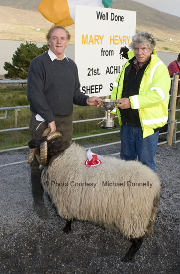 Michael J Corrigan (on right) presents the Martin Corrigan Perpetual Cup to Martin McGlynn for best Hogget Ram (confined) at the 21st Achill Sheep Show (Taispentas Caorach Acla 2007) at Johnny Pattens Bar, Derreens Achill. Photo:  Michael Donnelly